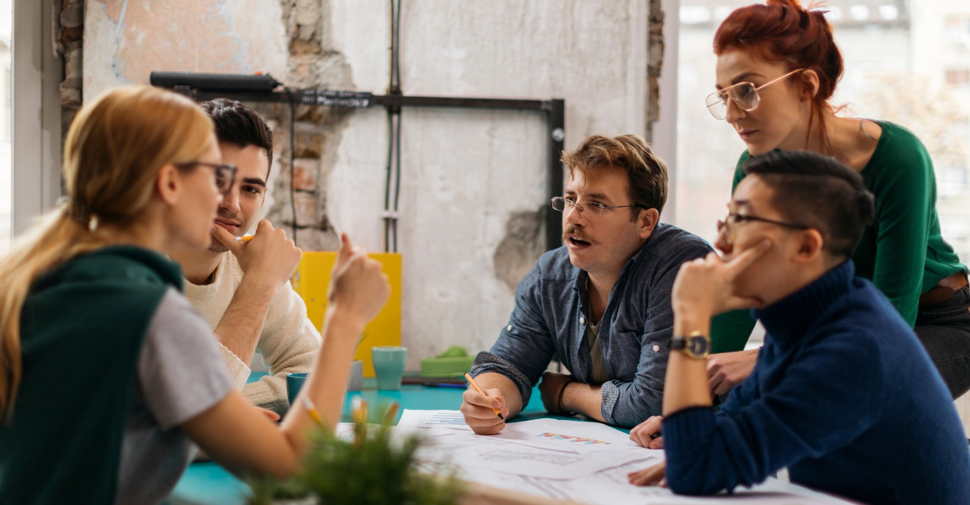 image of team members working together